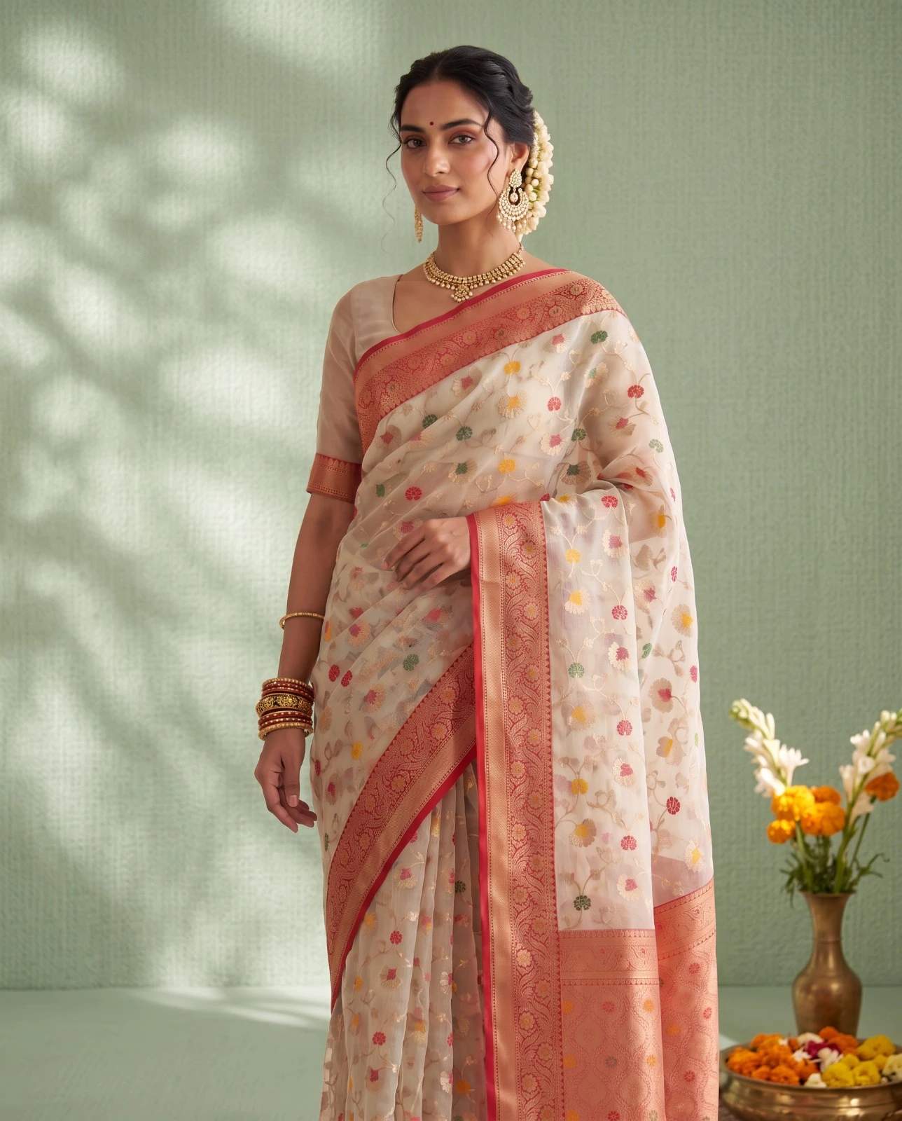 Exquisite Off-White Floral Woven Maslin Organza Saree with Red Zari Border